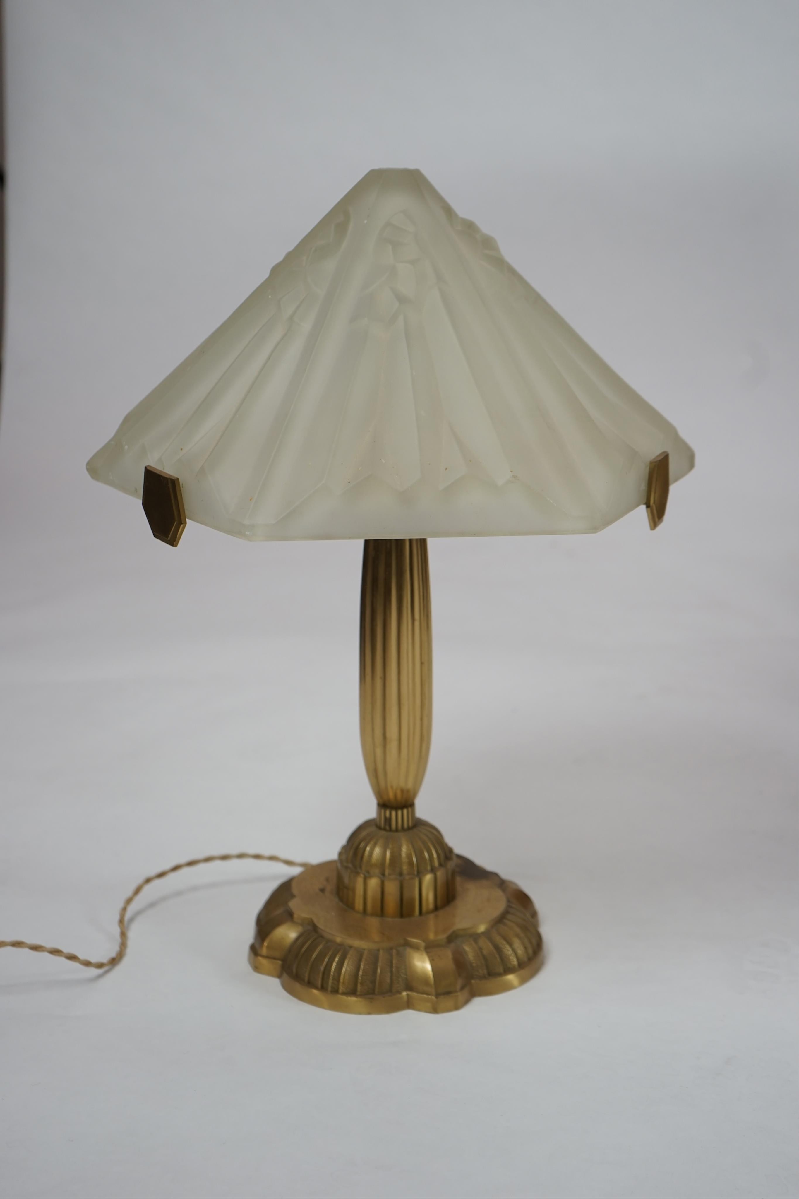 An Art Deco matt gilt brass table lamp with frosted glass shade